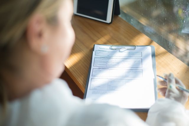 a person filling out an application form