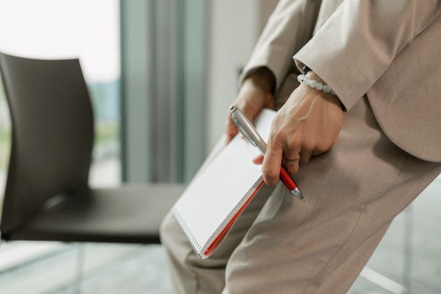 a person holding a notepad