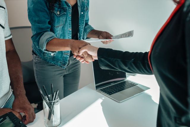 two people shaking hands